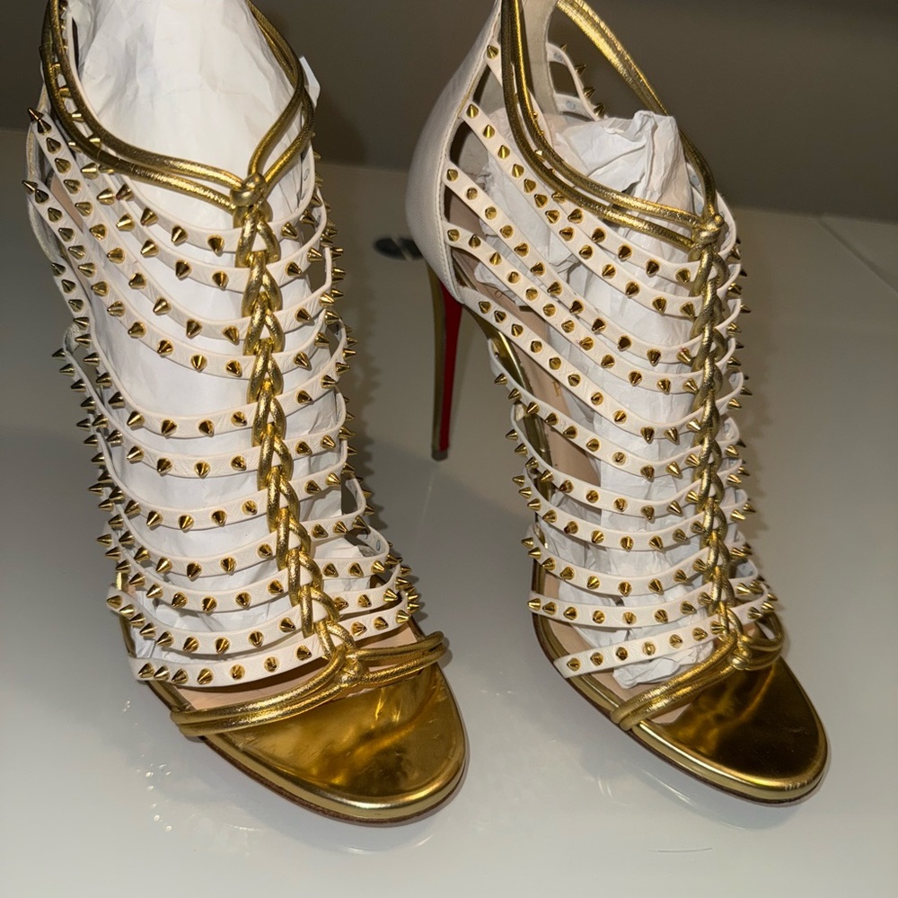 Christian Louboutin Spike Accents Leather Gladiator.